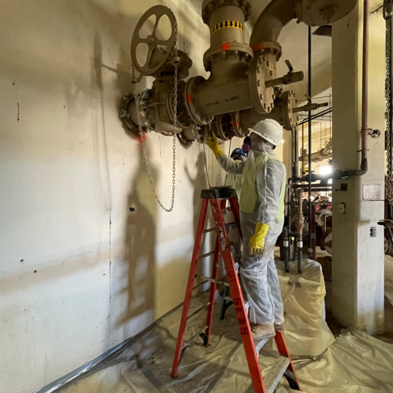 Worker Doing Abatement in Factory